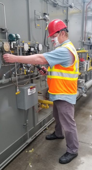 Worker testing air and water levels