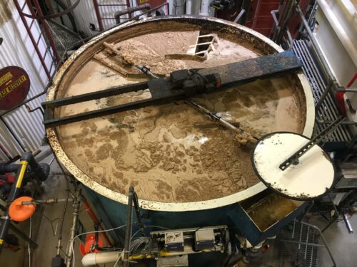 A top-down view of a clarifier for industrial wastewater treatment.